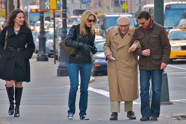 man helping older man man helping older man
